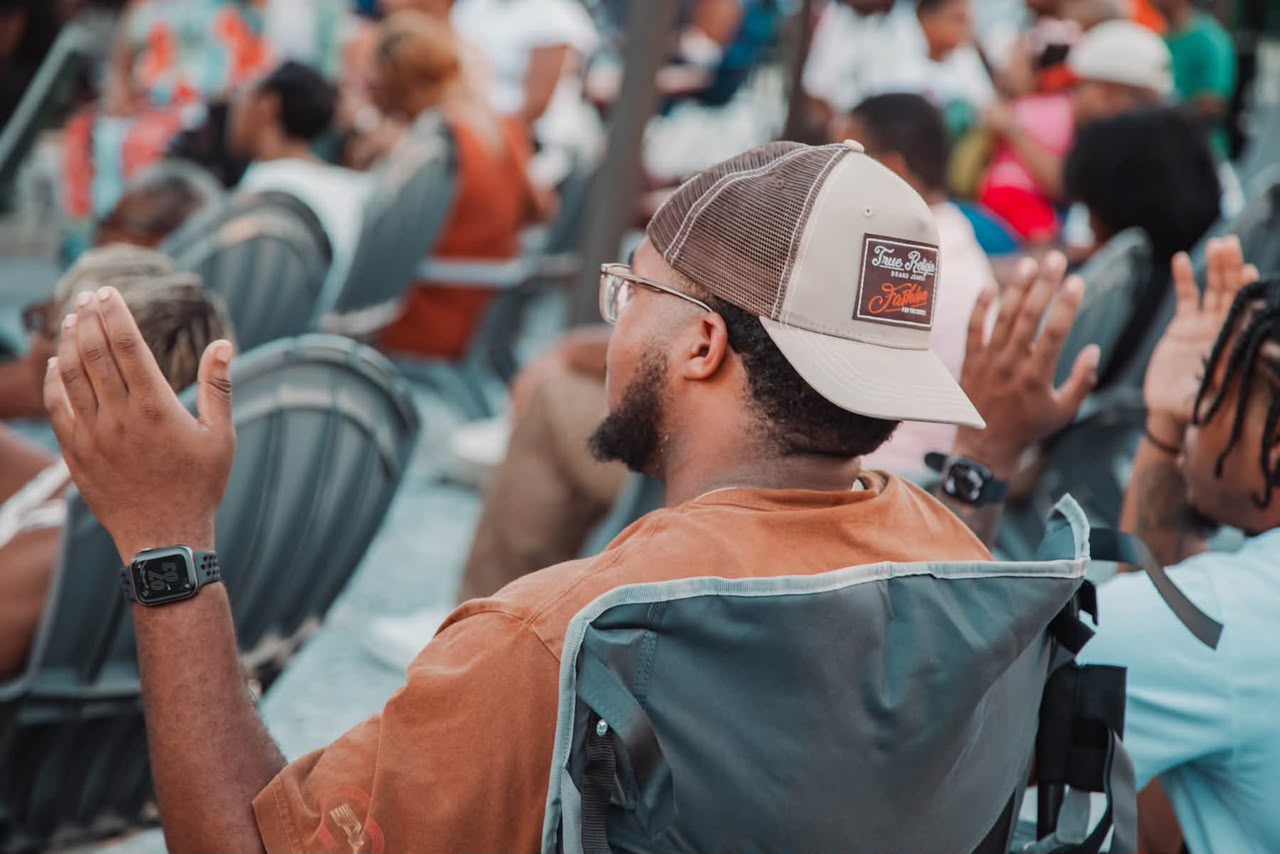 Worship leader singing with eyes closed